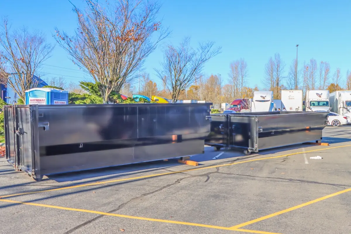 Professional dumpster rental service with roll-off container on residential driveway in American Canyon